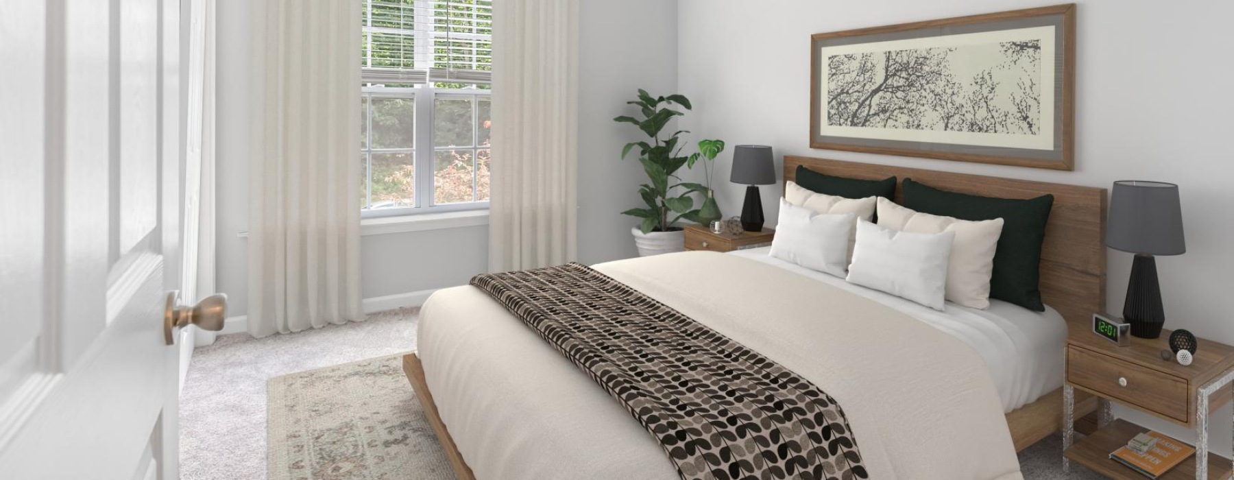 a bedroom with a bed and a plant